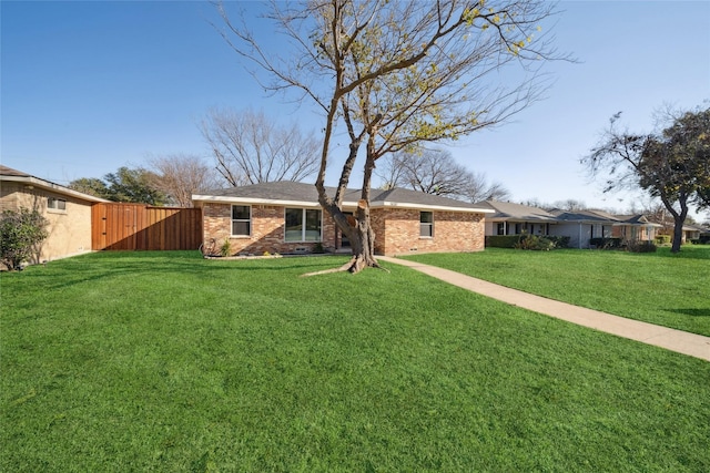 single story home with a front lawn