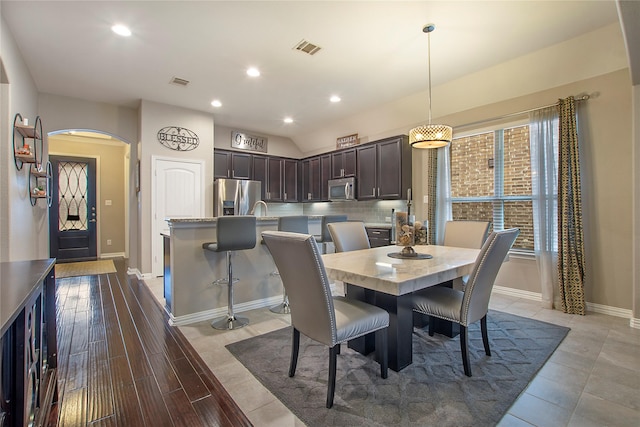 dining room featuring hardwood / wood-style floors and sink