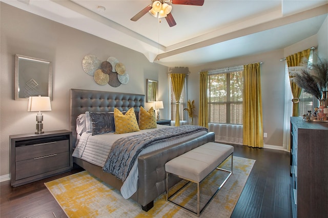 bedroom with dark hardwood / wood-style floors and ceiling fan