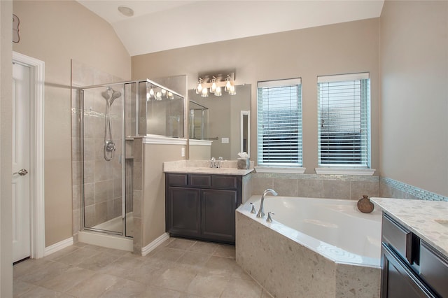 bathroom featuring tile patterned flooring, vanity, lofted ceiling, and shower with separate bathtub