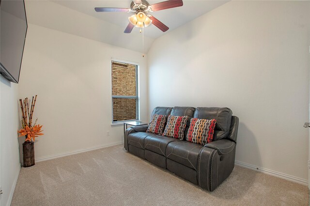 living room with ceiling fan, light colored carpet, and lofted ceiling