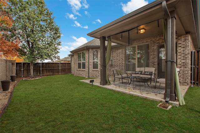 view of yard featuring an outdoor living space and a patio