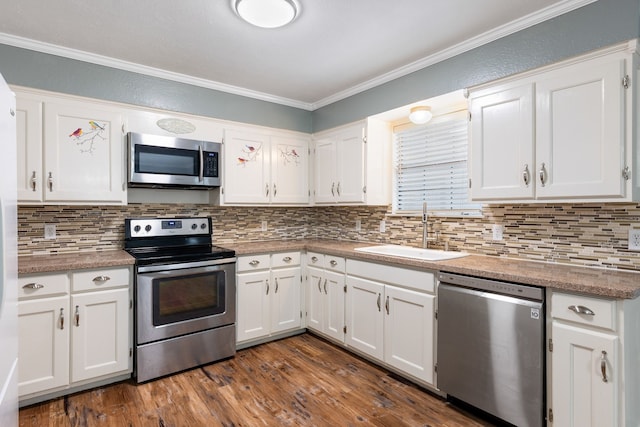 kitchen featuring white cabinetry, sink, appliances with stainless steel finishes, and dark wood-type flooring