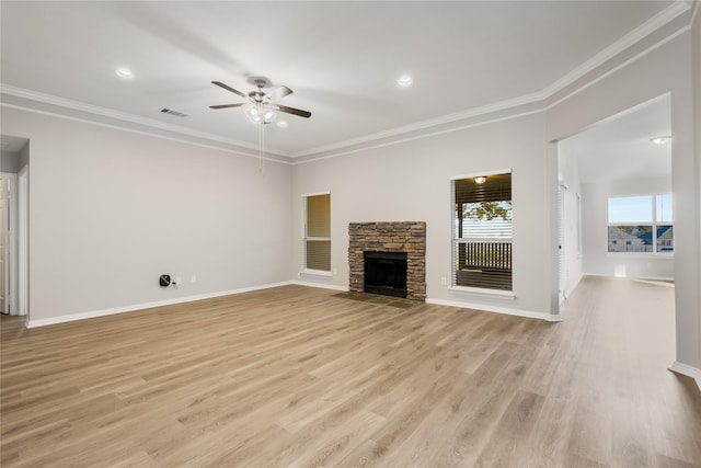 unfurnished living room with crown molding, a fireplace, and light hardwood / wood-style floors