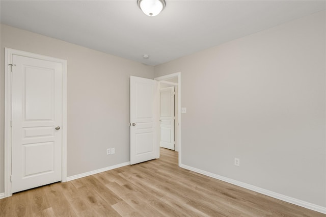 unfurnished room with light hardwood / wood-style floors