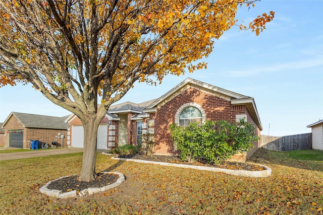 view of front of house with a garage and a front yard