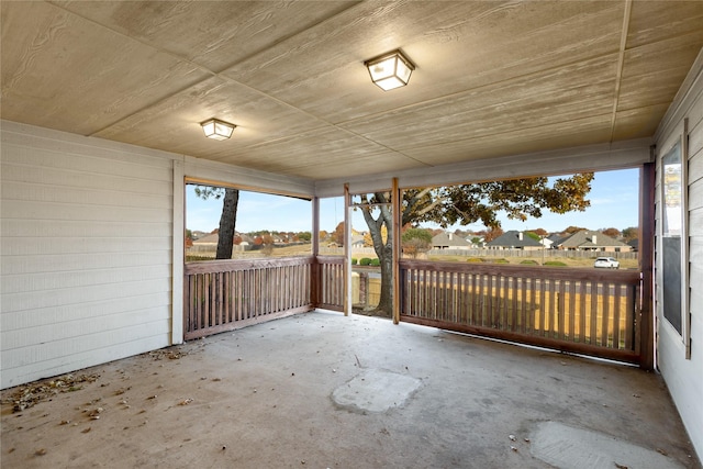 unfurnished sunroom featuring plenty of natural light