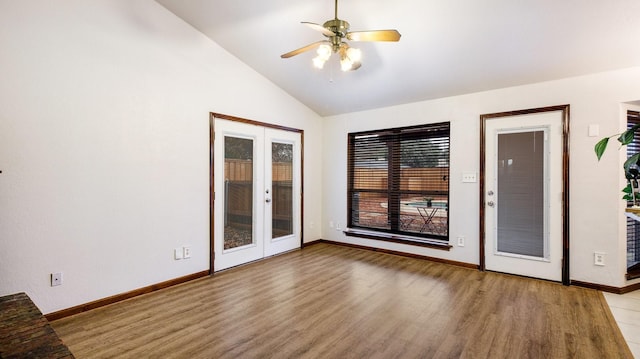 interior space featuring french doors, light hardwood / wood-style flooring, ceiling fan, and lofted ceiling