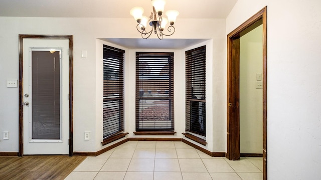 interior space featuring a chandelier and light wood-type flooring