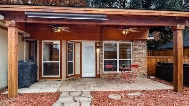 view of patio with area for grilling and ceiling fan