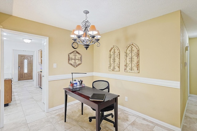 tiled office space featuring a textured ceiling and a notable chandelier