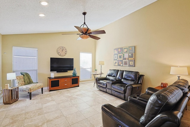 tiled living room featuring a textured ceiling, vaulted ceiling, and ceiling fan