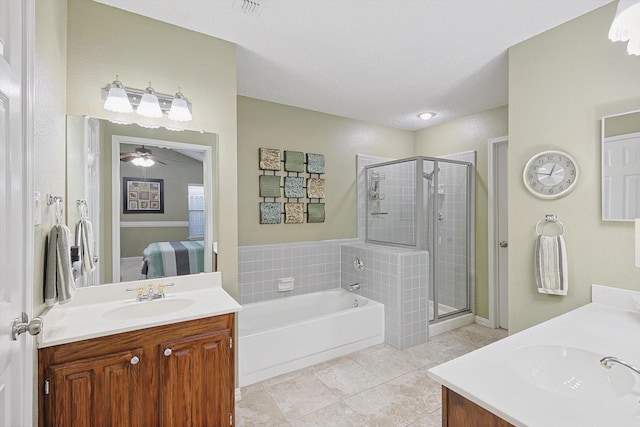 bathroom with tile patterned flooring, vanity, ceiling fan, and plus walk in shower