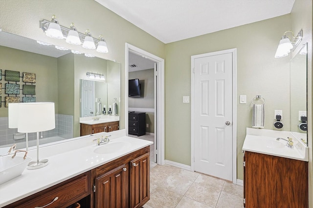 bathroom featuring tile patterned flooring and vanity