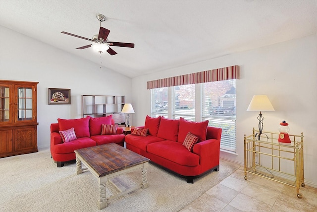 living room featuring ceiling fan and vaulted ceiling