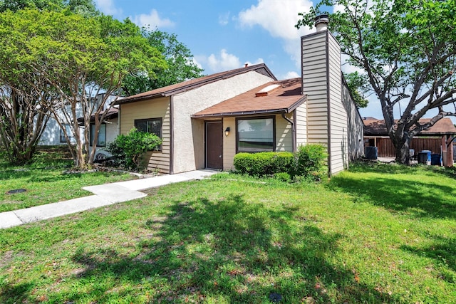 ranch-style house featuring a front lawn