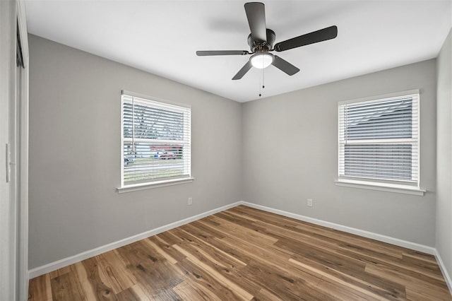 empty room featuring ceiling fan and wood-type flooring