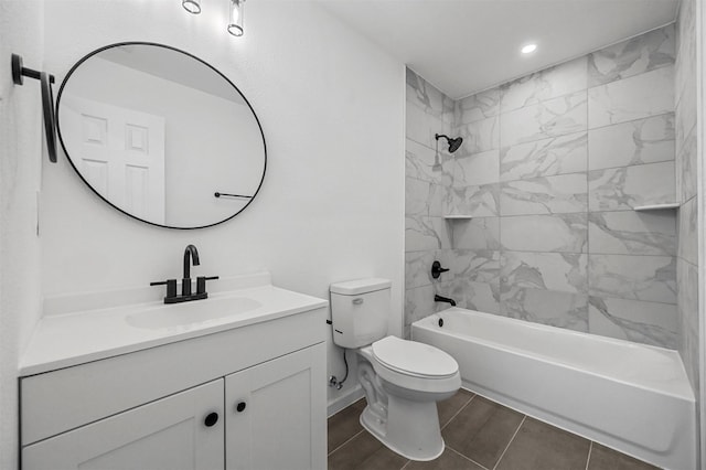 full bathroom with vanity, tiled shower / bath combo, and toilet