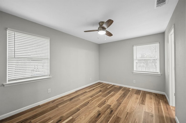 empty room featuring ceiling fan and wood-type flooring