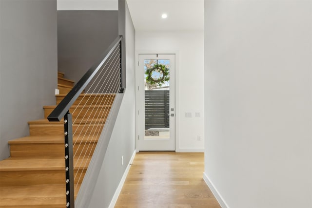 stairs with hardwood / wood-style floors