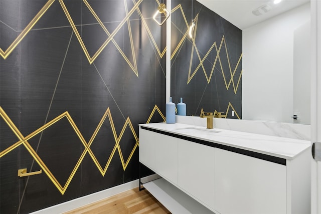 bathroom featuring vanity and hardwood / wood-style floors