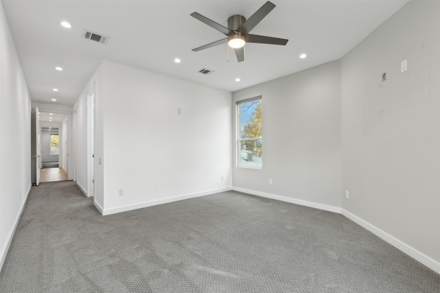 carpeted empty room with ceiling fan