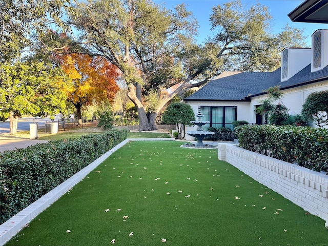 view of yard with fence