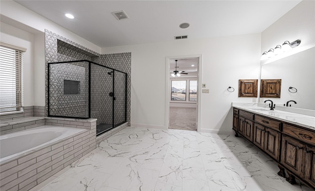 bathroom featuring vanity and shower with separate bathtub