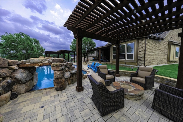 view of patio with an outdoor living space with a fire pit and a pergola