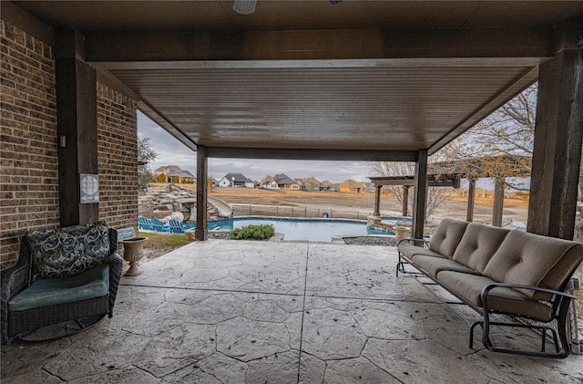 view of patio / terrace featuring a fenced in pool