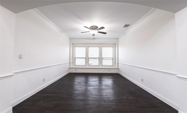 spare room with ceiling fan, ornamental molding, and dark hardwood / wood-style floors