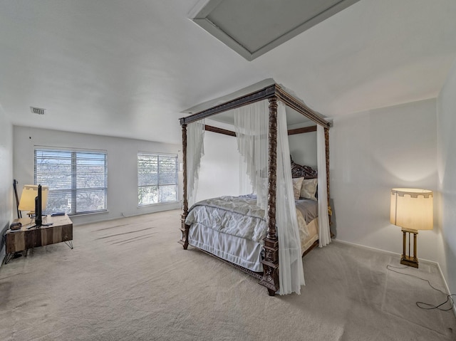 bedroom with light colored carpet