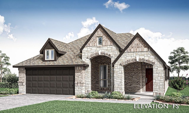 view of front of property with a garage and a front lawn