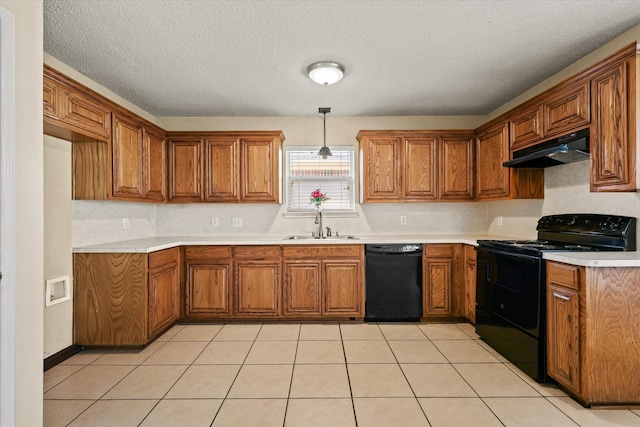 kitchen with sink, decorative light fixtures, a textured ceiling, light tile patterned floors, and black appliances