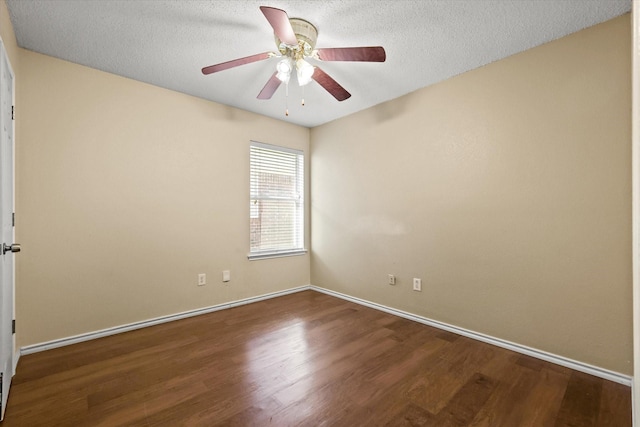 empty room with ceiling fan, hardwood / wood-style floors, and a textured ceiling