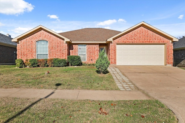 single story home with a garage and a front lawn