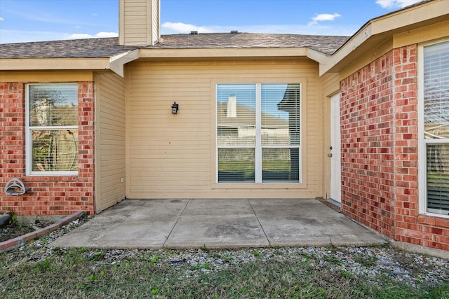 entrance to property featuring a patio area