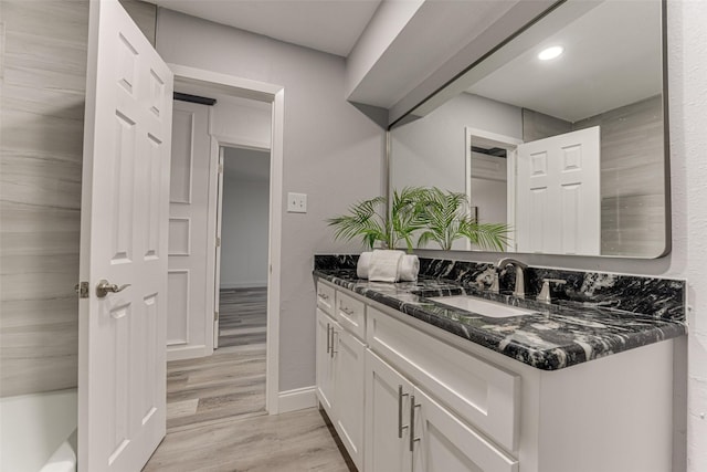 5503 Pecan Grove Dr, Sachse, TX 75048 - bathroom featuring wood finished floors, vanity, recessed lighting, and baseboards