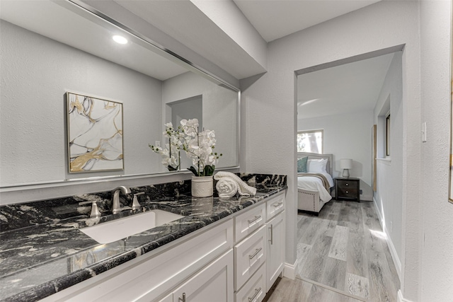 bathroom featuring hardwood / wood-style floors and vanity