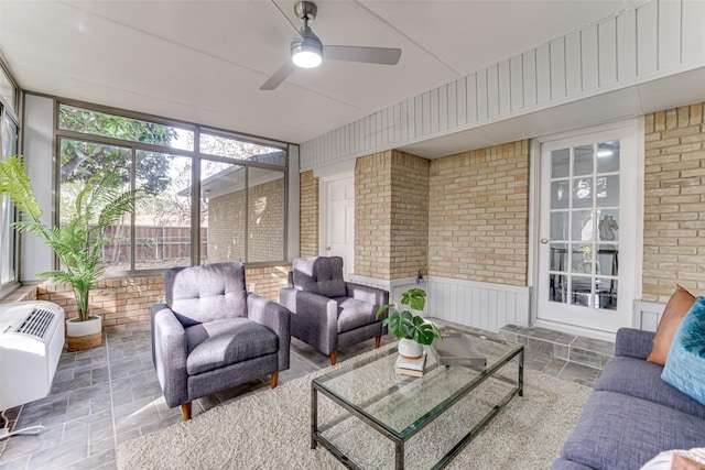 sunroom featuring ceiling fan