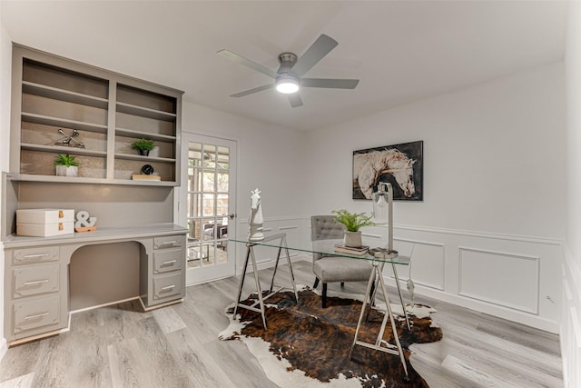 home office featuring ceiling fan and light hardwood / wood-style flooring