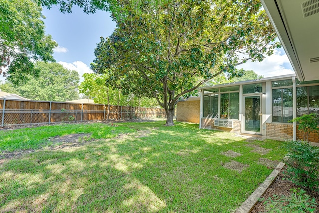 view of yard featuring a sunroom