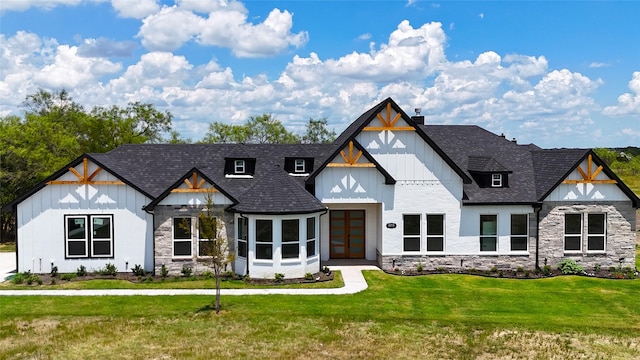 view of front of property with a front lawn and french doors