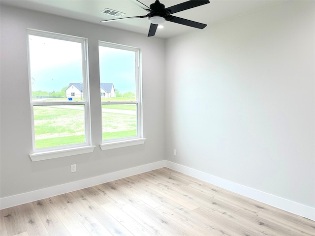 unfurnished room featuring ceiling fan and light wood-type flooring