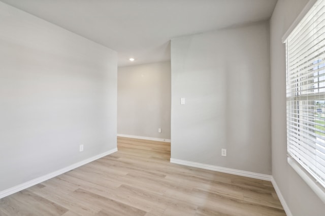 spare room with light wood-type flooring