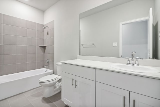 full bathroom with tile patterned floors, vanity, toilet, and tiled shower / bath