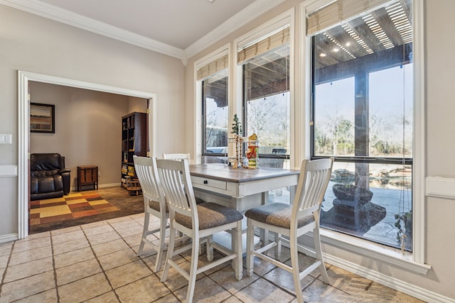 dining area featuring plenty of natural light and ornamental molding