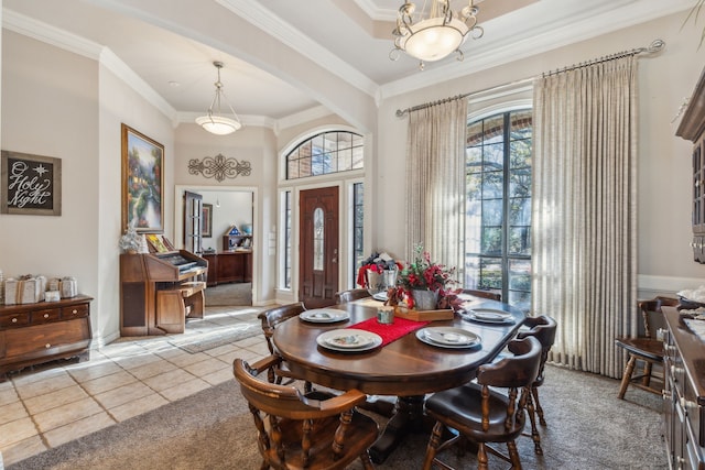 dining room featuring light tile patterned floors and ornamental molding