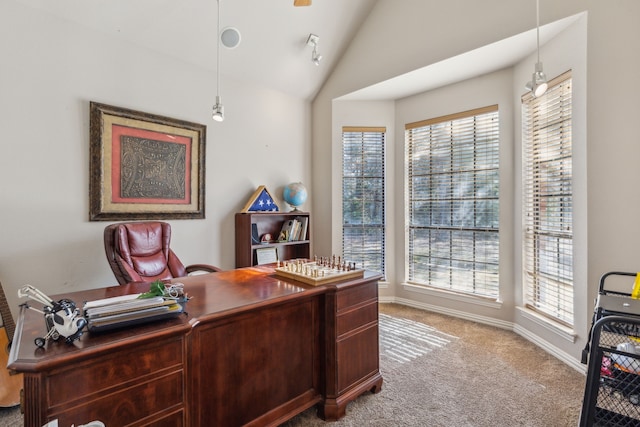 carpeted office space featuring lofted ceiling