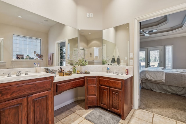 bathroom featuring ceiling fan, crown molding, vanity, and walk in shower